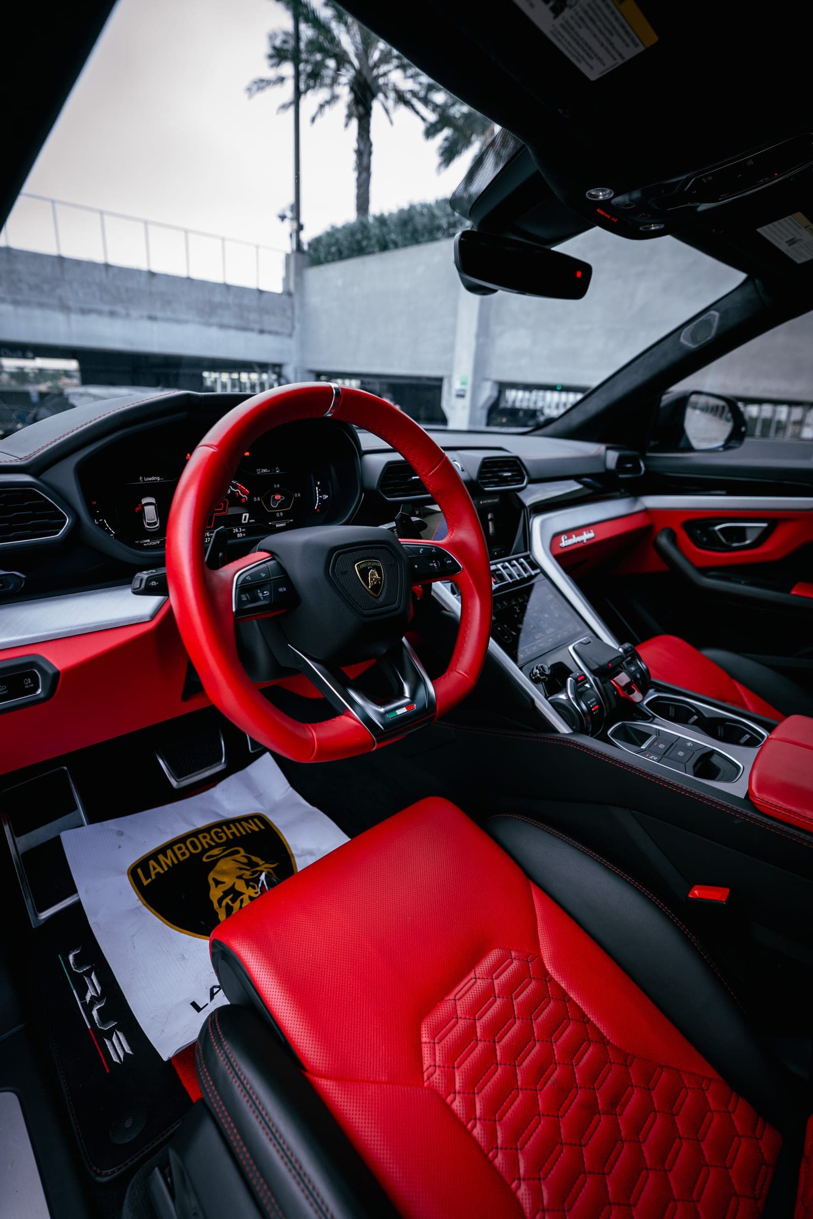 Red leather interior and red steering wheel of a Lamborghini Urus